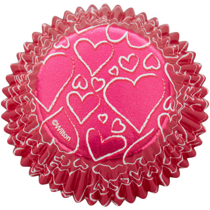 https://cakeandcandysupply.com/cdn/shop/products/415-0-0612-Wilton-Pink-Hearts-Valentines-Day-Foil-Cupcake-Liners-24-Count-A2_700x700.jpg?v=1644715419