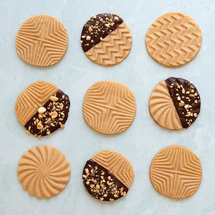 https://cakeandcandysupply.com/cdn/shop/products/nordic-ware-geo-cookie-stamps-1-o_700x700.jpg?v=1645977093
